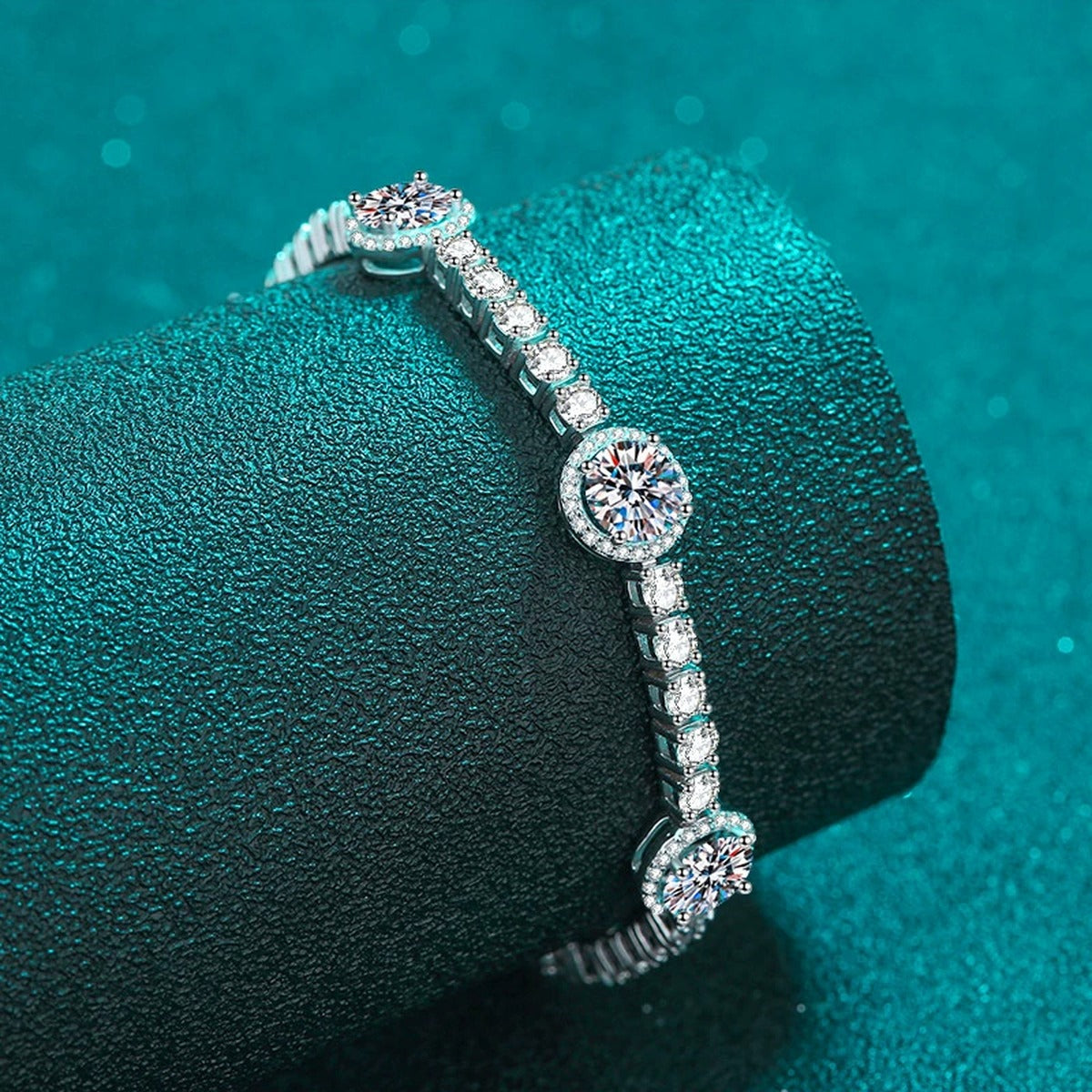 Halo Station Moissanite Bracelet in Rhodium-Plated S925 sterling silver angled product display showing bracelet silhouette