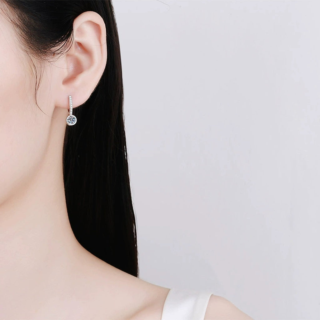 Round Moissanite Hoop Drop Earrings with CZ in Rhodium-Plated S925 sterling silver worn on ear by model showing scale, placement, and hoop drop earrings styling