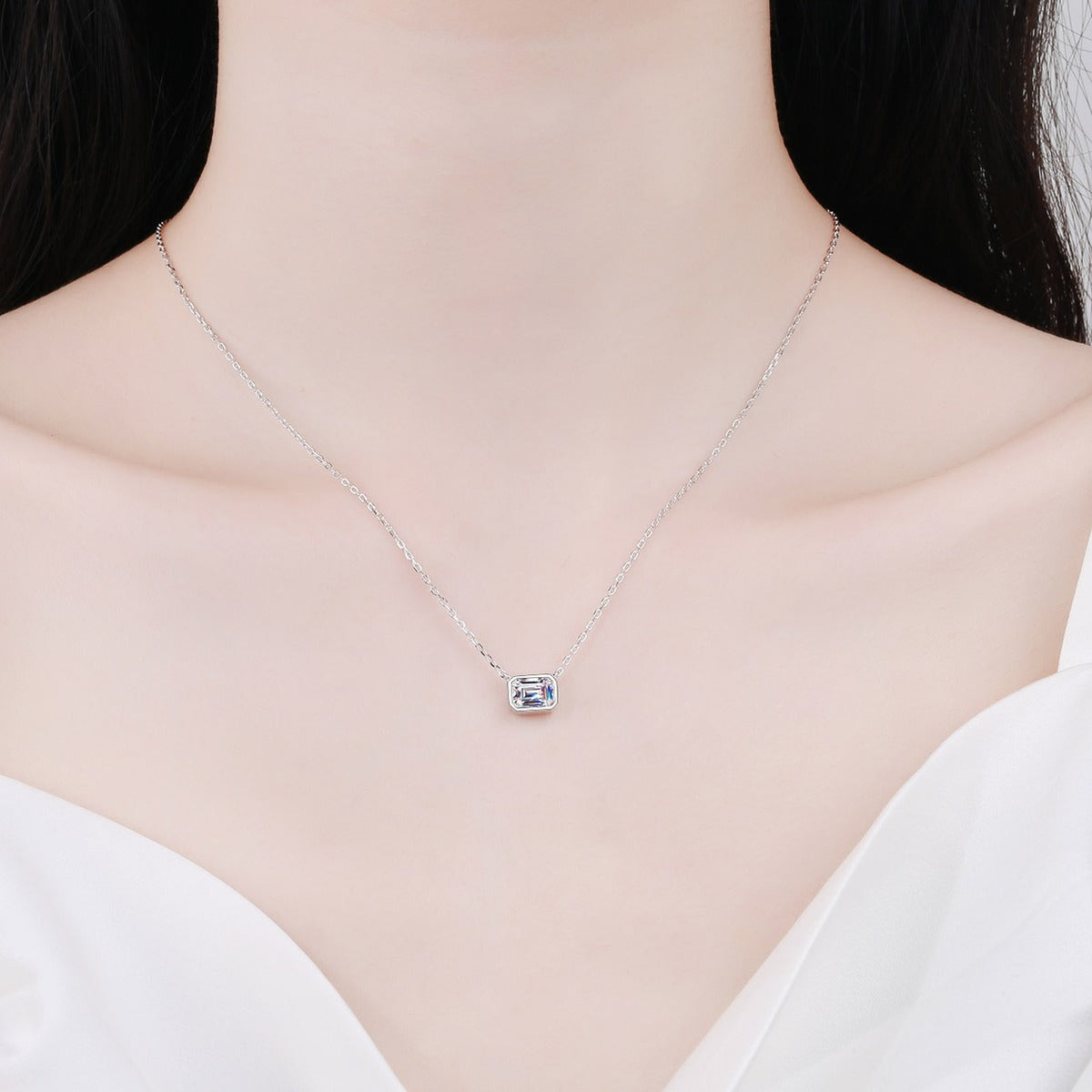 Emerald Cut Solitaire Moissanite Necklace in Rhodium-Plated S925 sterling silver neckline model view showing pendant scale and adjustable chain