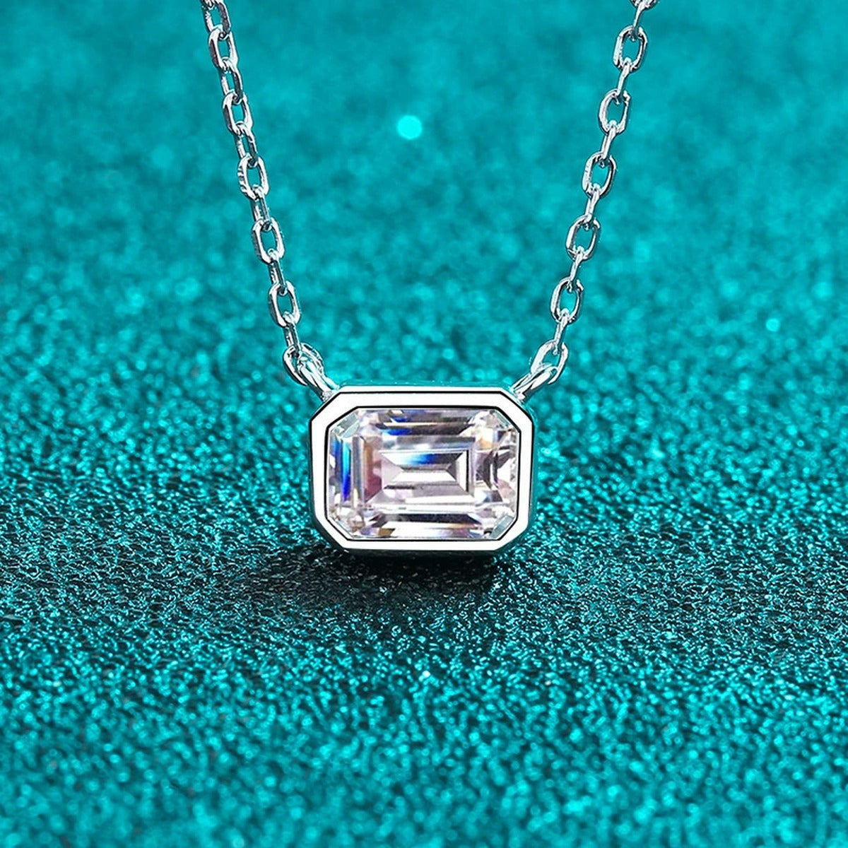 Emerald Cut Solitaire Moissanite Necklace in Rhodium-Plated S925 sterling silver angled product detail view