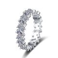 Round and Emerald Cut Moissanite Eternity Ring in rhodium-plated S925 sterling silver on clean white background