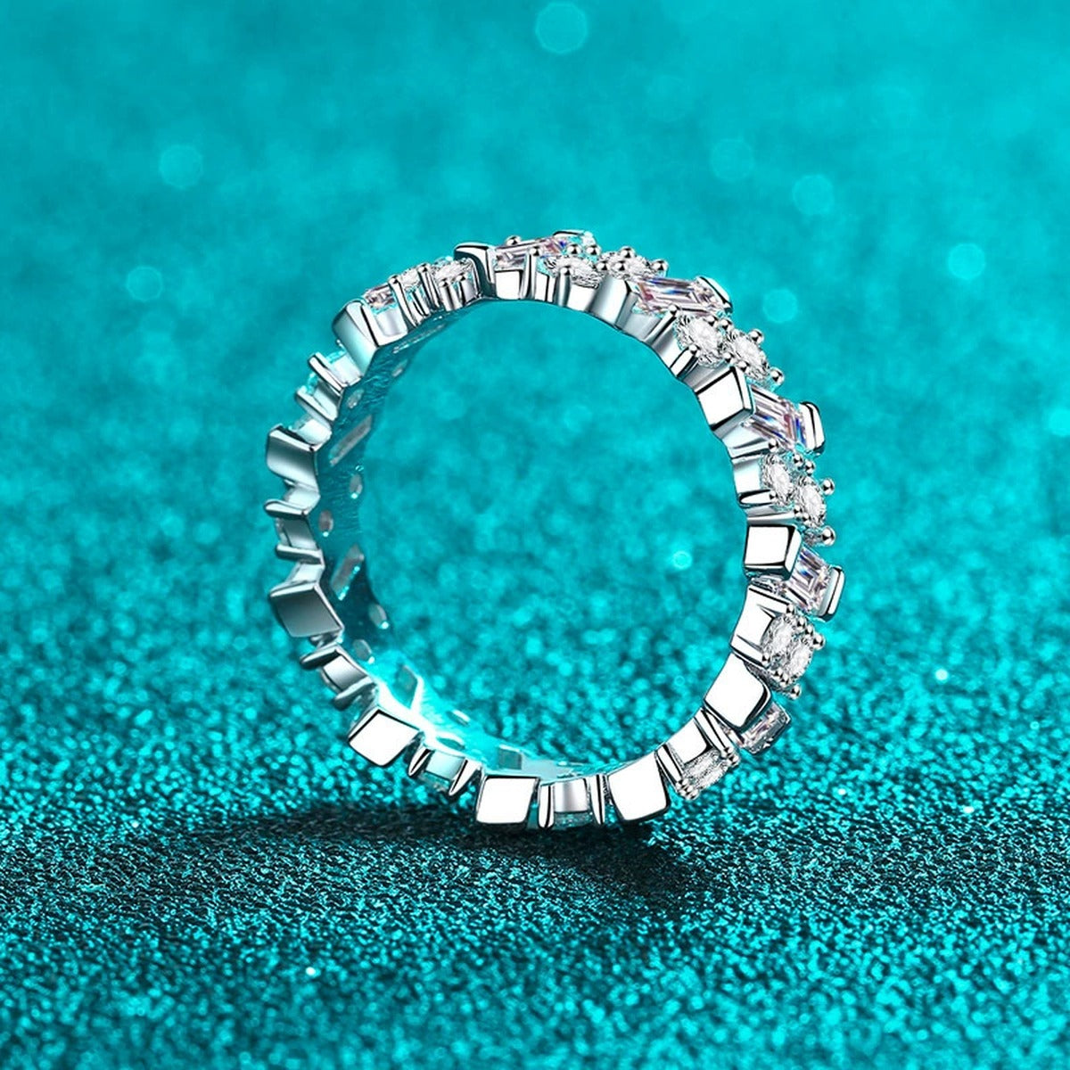 Round and Emerald Cut Moissanite Eternity Ring product view showing moissanite setting and rhodium finish