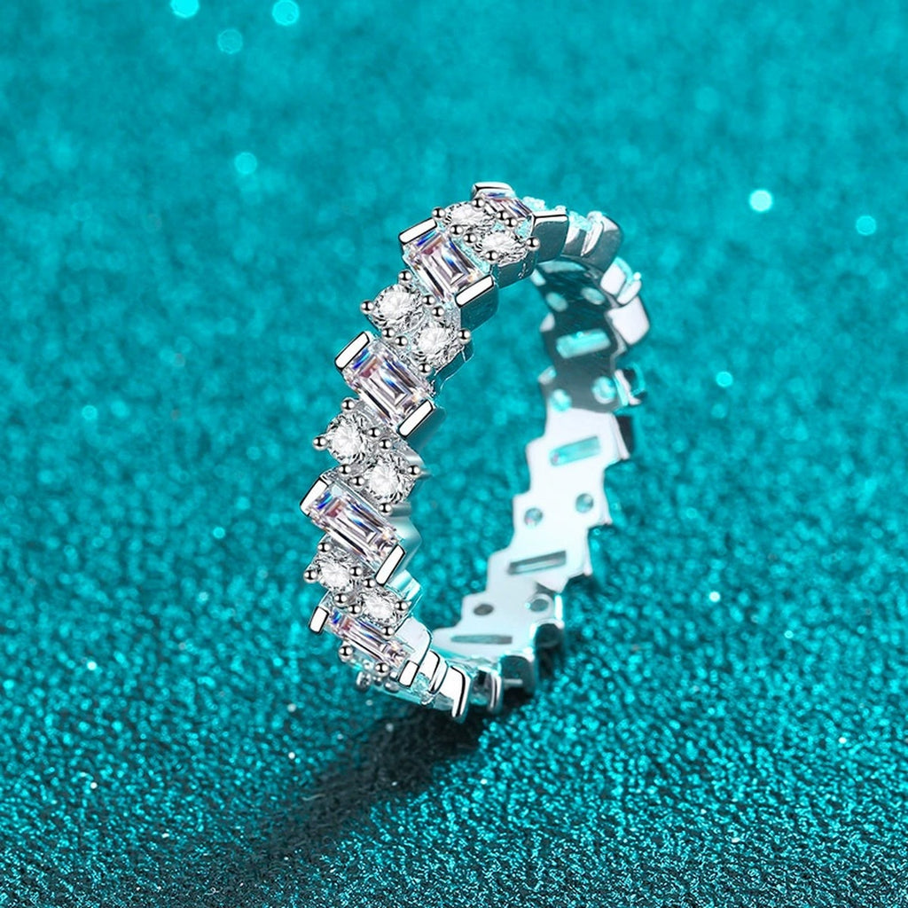 Round and Emerald Cut Moissanite Eternity Ring product view showing moissanite setting and rhodium finish