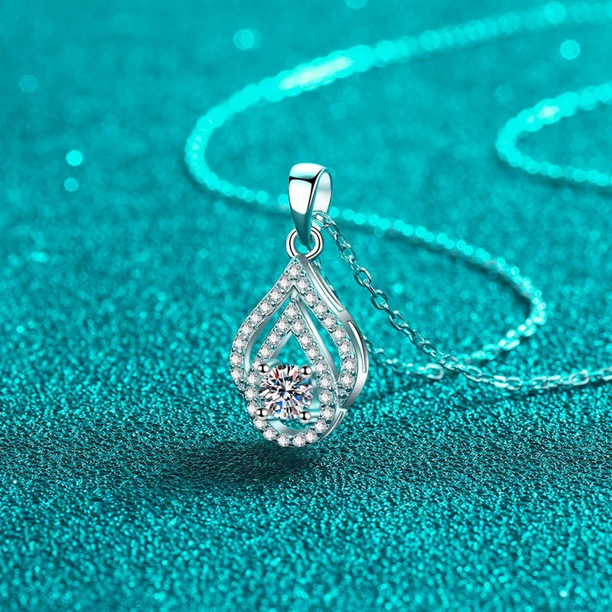 Teardrop Moissanite Pendant Necklace with CZ in Rhodium-Plated S925 sterling silver blue display scene showing chain and stone layout
