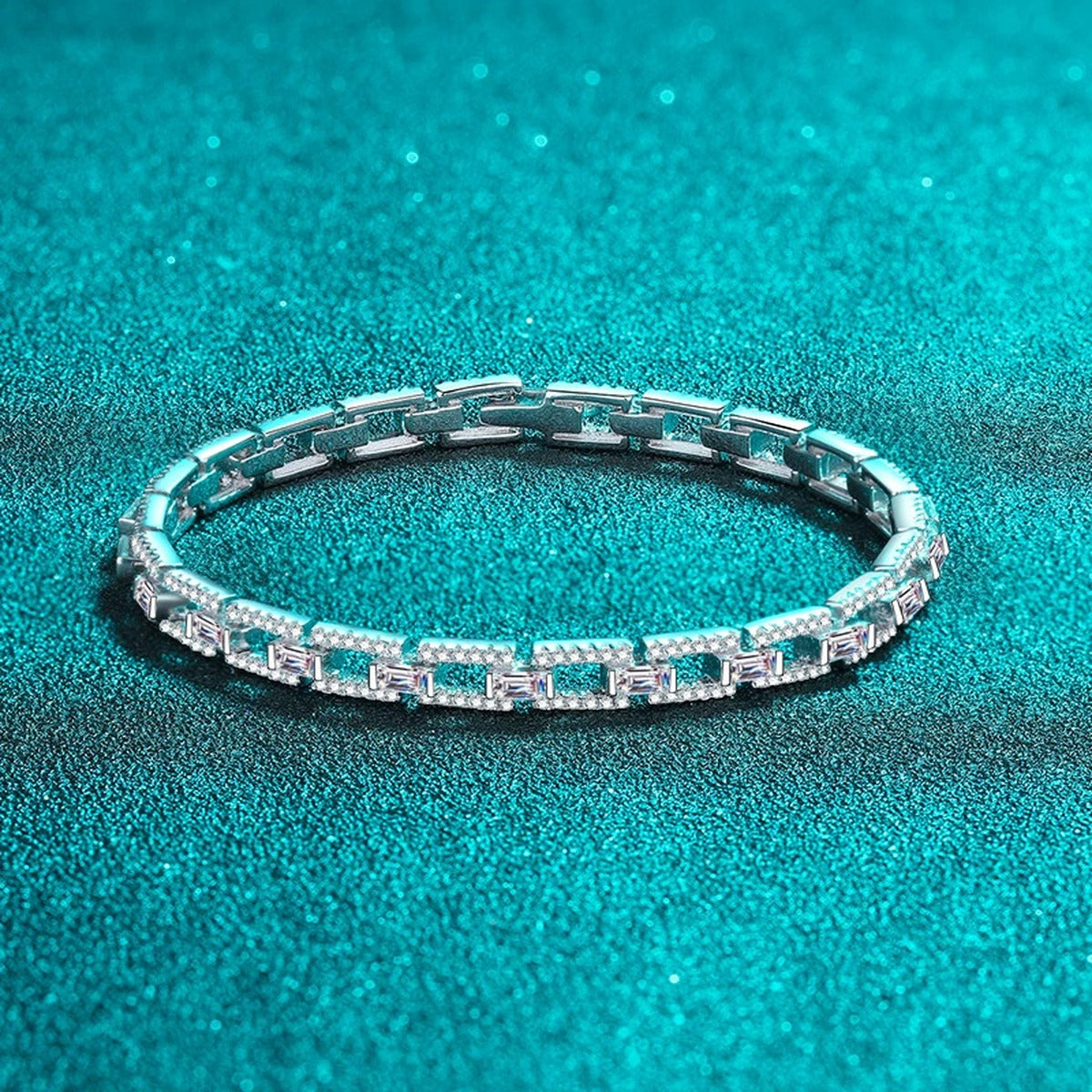 Emerald and Round Moissanite Tennis Bracelet in Rhodium-Plated S925 sterling silver styled product scene showing stone sparkle and chain detail