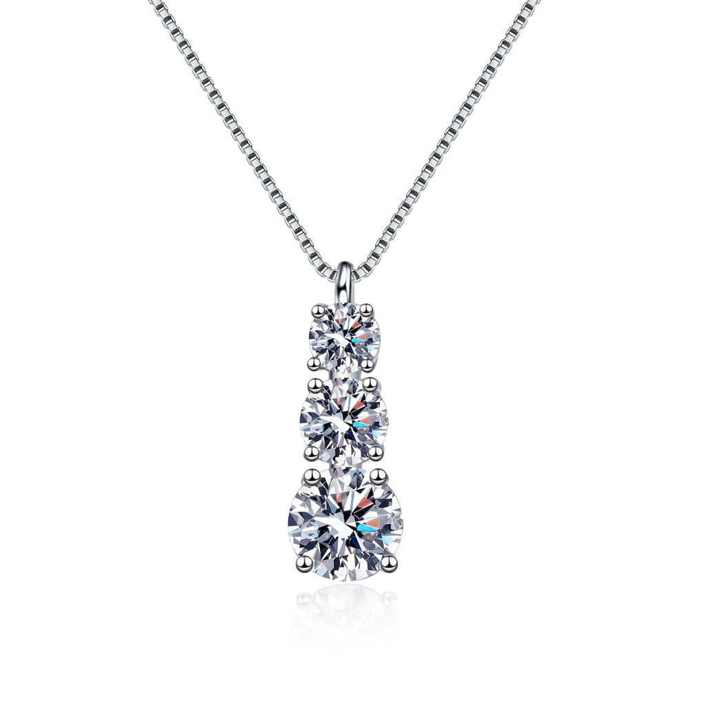 Graduated Moissanite Pendant Necklace in Rhodium-Plated S925 sterling silver white background product photo showing vertical graduated pendant with round moissanite stones in several sizes
