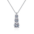 Graduated Moissanite Pendant Necklace in Rhodium-Plated S925 sterling silver white background product photo showing vertical graduated pendant with round moissanite stones in several sizes