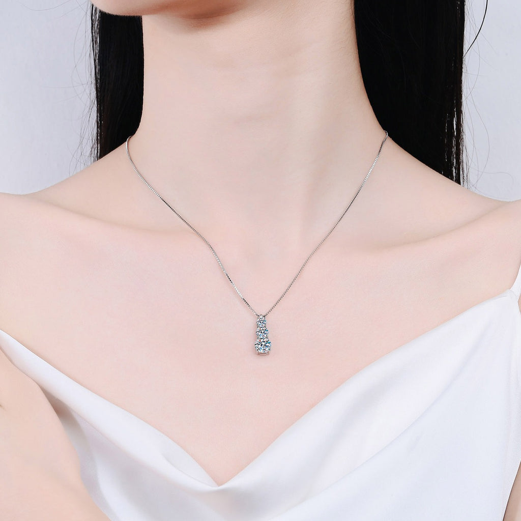 Graduated Moissanite Pendant Necklace in Rhodium-Plated S925 sterling silver neckline model view showing pendant scale and adjustable chain