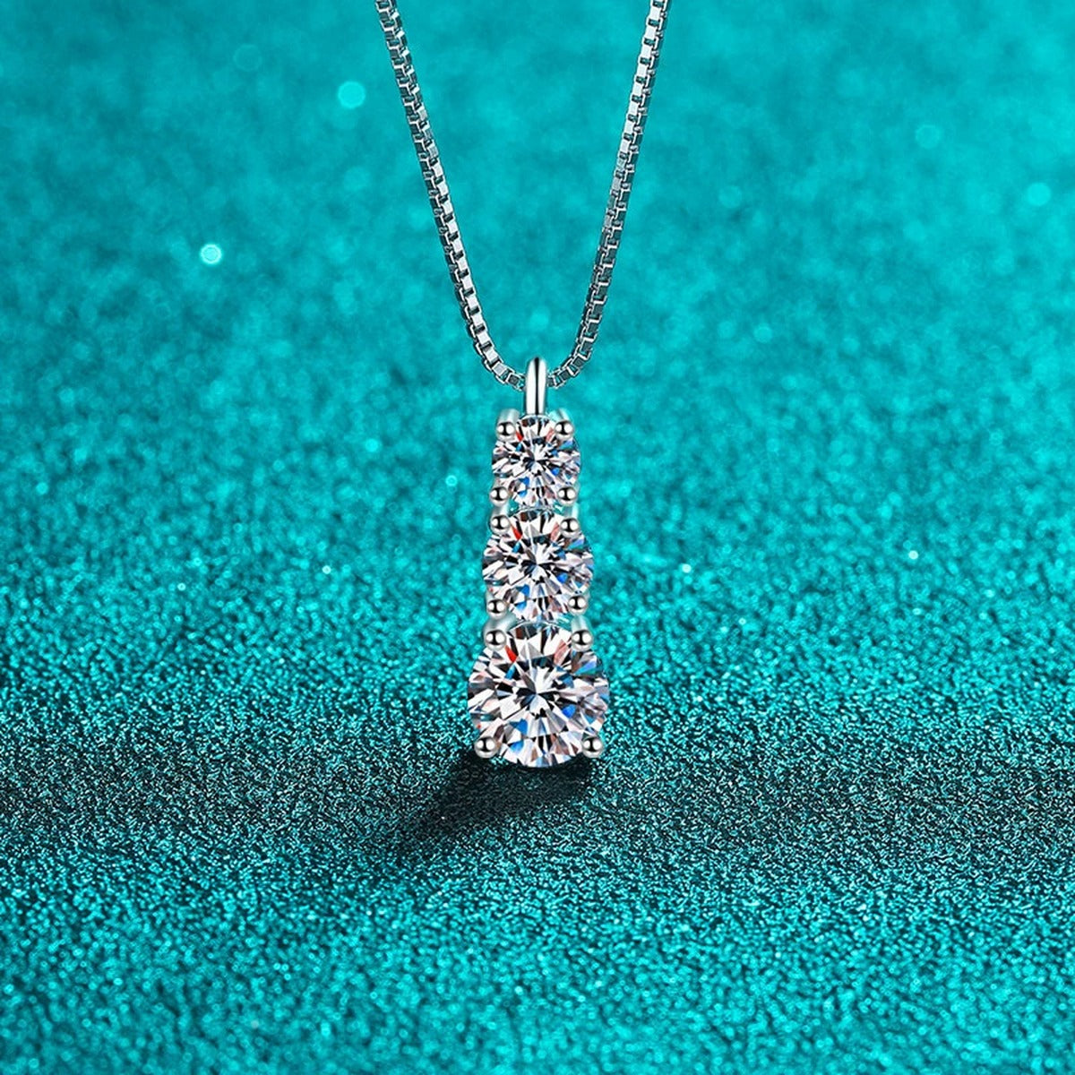 Graduated Moissanite Pendant Necklace in Rhodium-Plated S925 sterling silver close-up product scene showing pendant setting