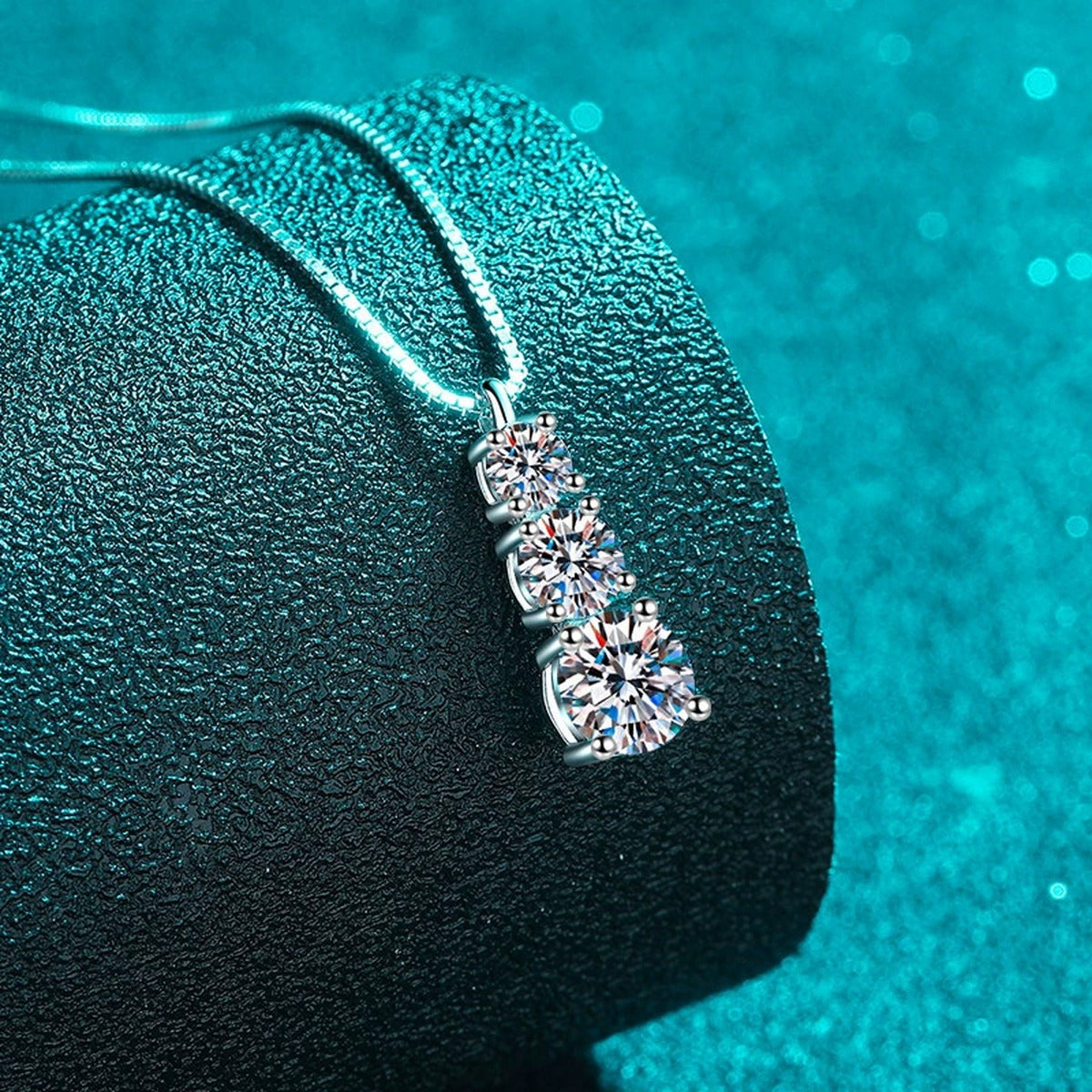 Graduated Moissanite Pendant Necklace in Rhodium-Plated S925 sterling silver angled product detail view
