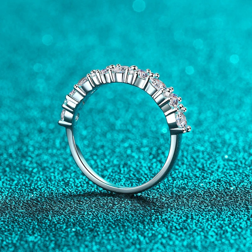 Round Moissanite Twist Band Ring product view showing moissanite setting and rhodium finish