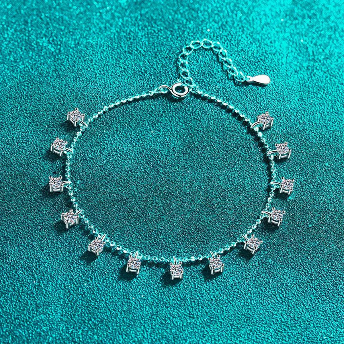 Moissanite Charm Station Bracelet in Rhodium-Plated S925 sterling silver styled product scene showing stone sparkle and chain detail