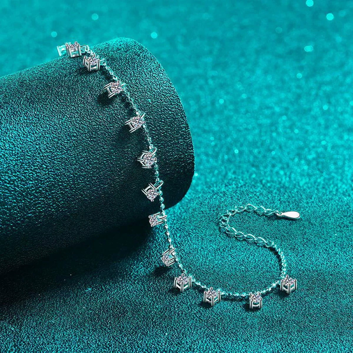 Moissanite Charm Station Bracelet in Rhodium-Plated S925 sterling silver angled product display showing bracelet silhouette