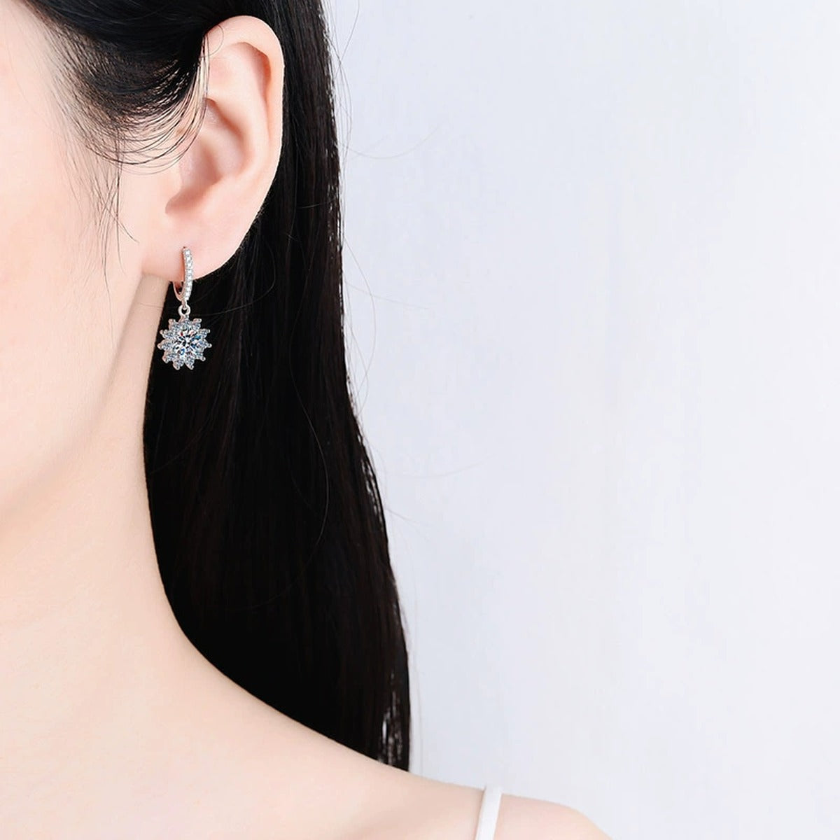 Starburst Moissanite Hoop Dangle Earrings with CZ in Rhodium-Plated S925 sterling silver worn on ear by model showing scale, placement, and hoop dangle earrings styling