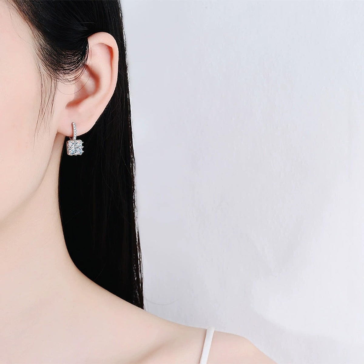 Princess Cut Moissanite Hoop Drop Earrings with CZ in Rhodium-Plated S925 sterling silver worn on ear by model showing scale, placement, and hoop drop earrings styling