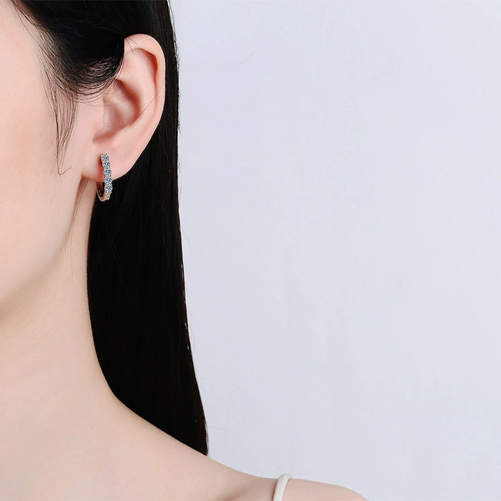 Pave Moissanite Hoop Earrings in Rhodium-Plated S925 sterling silver worn on ear by model showing scale, placement, and hoop earrings styling