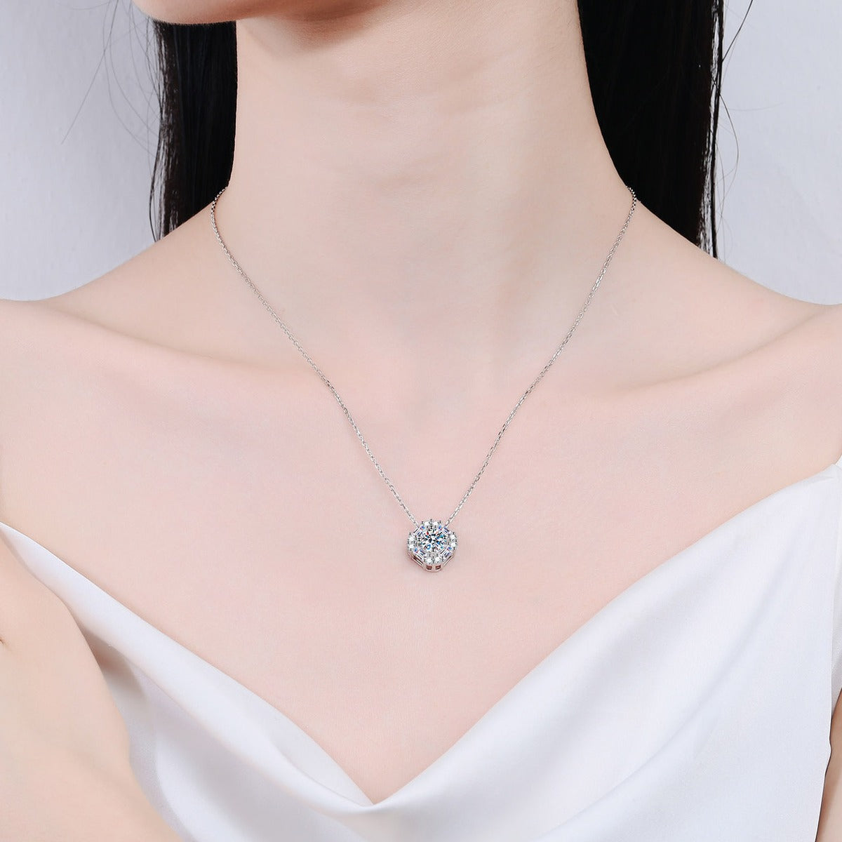 Round Halo Moissanite Pendant Necklace in Rhodium-Plated S925 sterling silver neckline model view showing pendant scale and adjustable chain