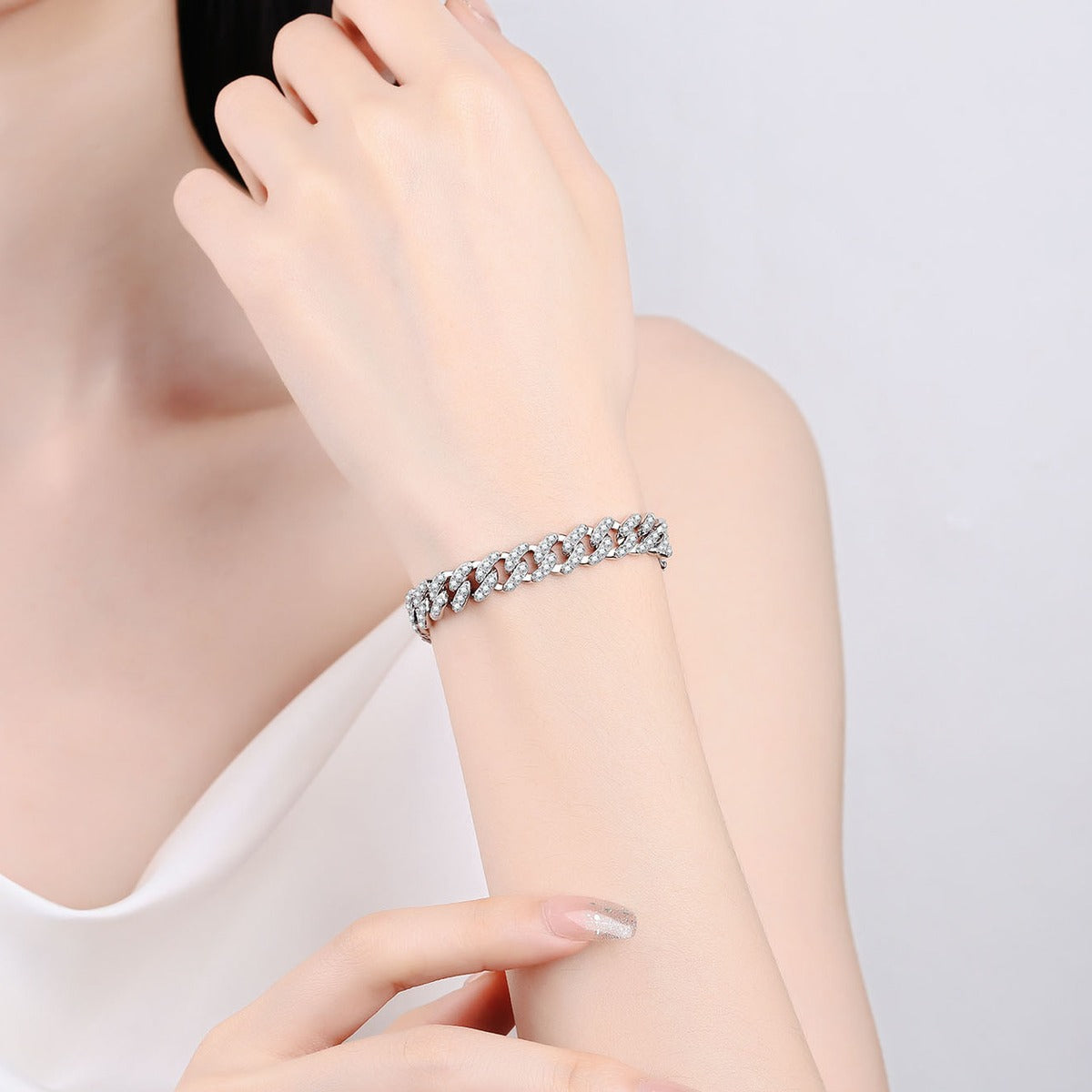 Cuban Chain Moissanite Bracelet in Rhodium-Plated S925 sterling silver worn on wrist model view showing scale and adjustable fit