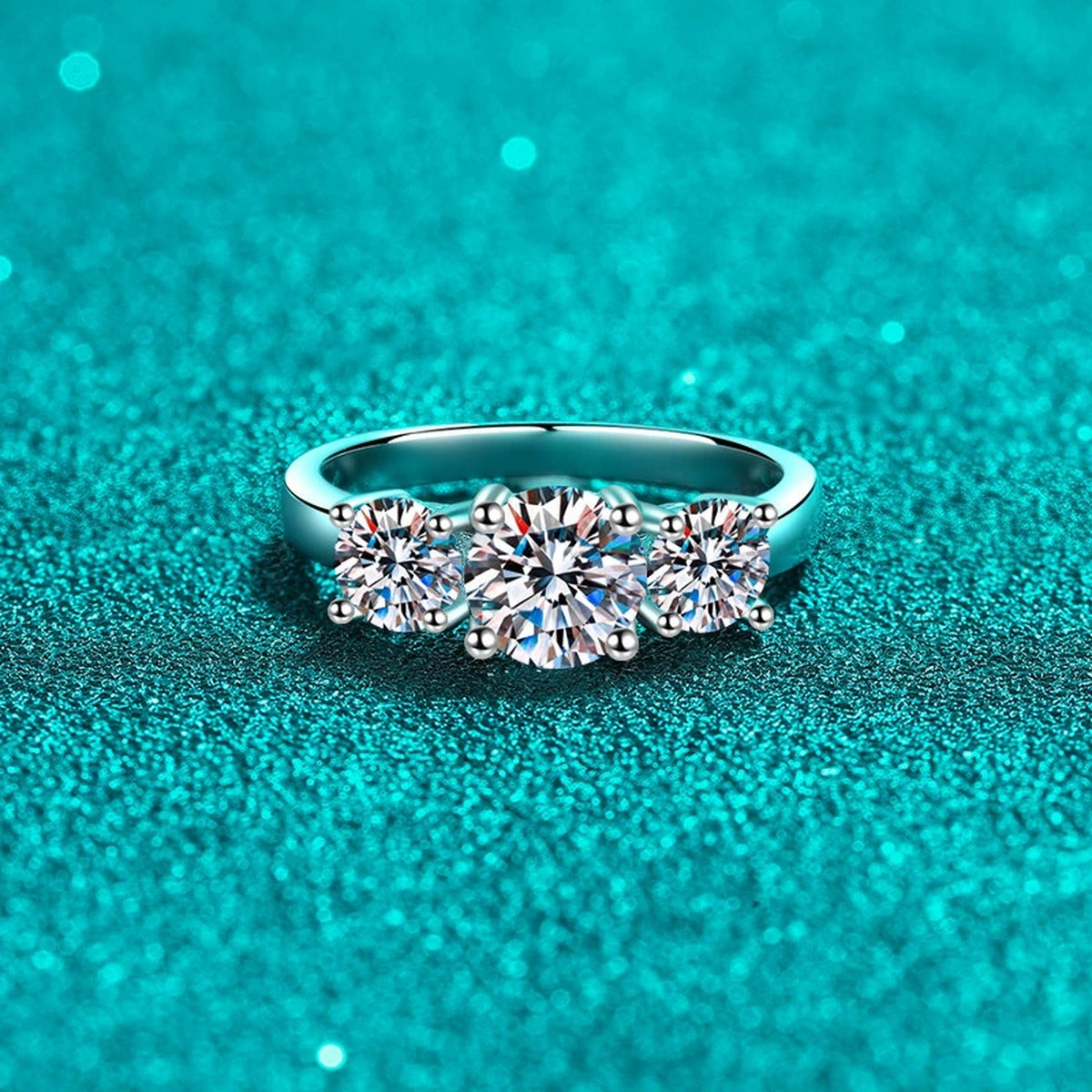 Three Stone Round Moissanite Ring product view showing moissanite setting and rhodium finish