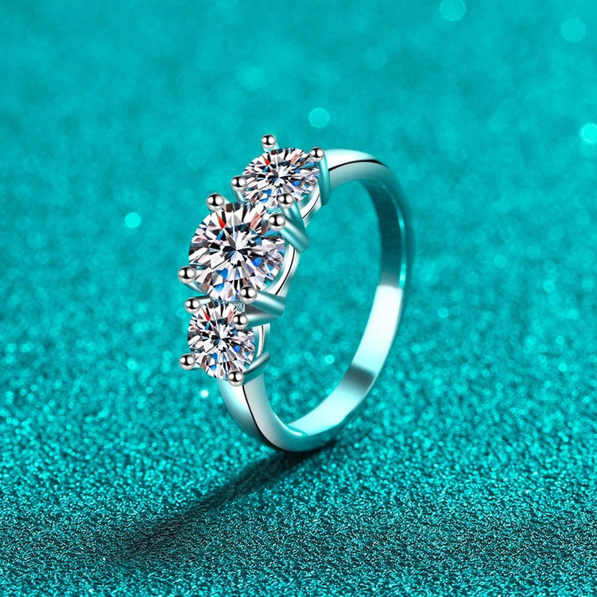 Three Stone Round Moissanite Ring product view showing moissanite setting and rhodium finish