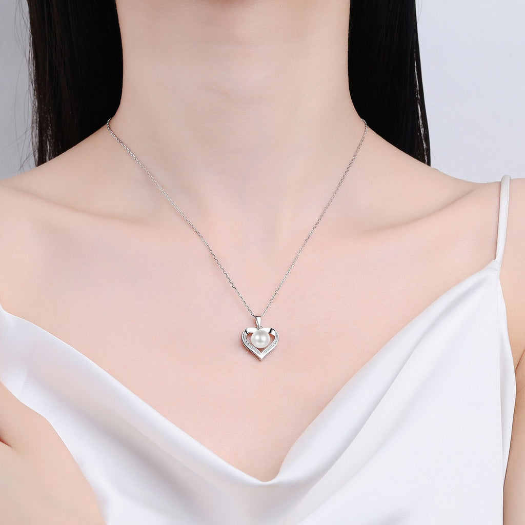 Heart Moissanite Pearl Pendant Necklace in Rhodium-Plated S925 sterling silver neckline model view showing pendant scale and adjustable chain