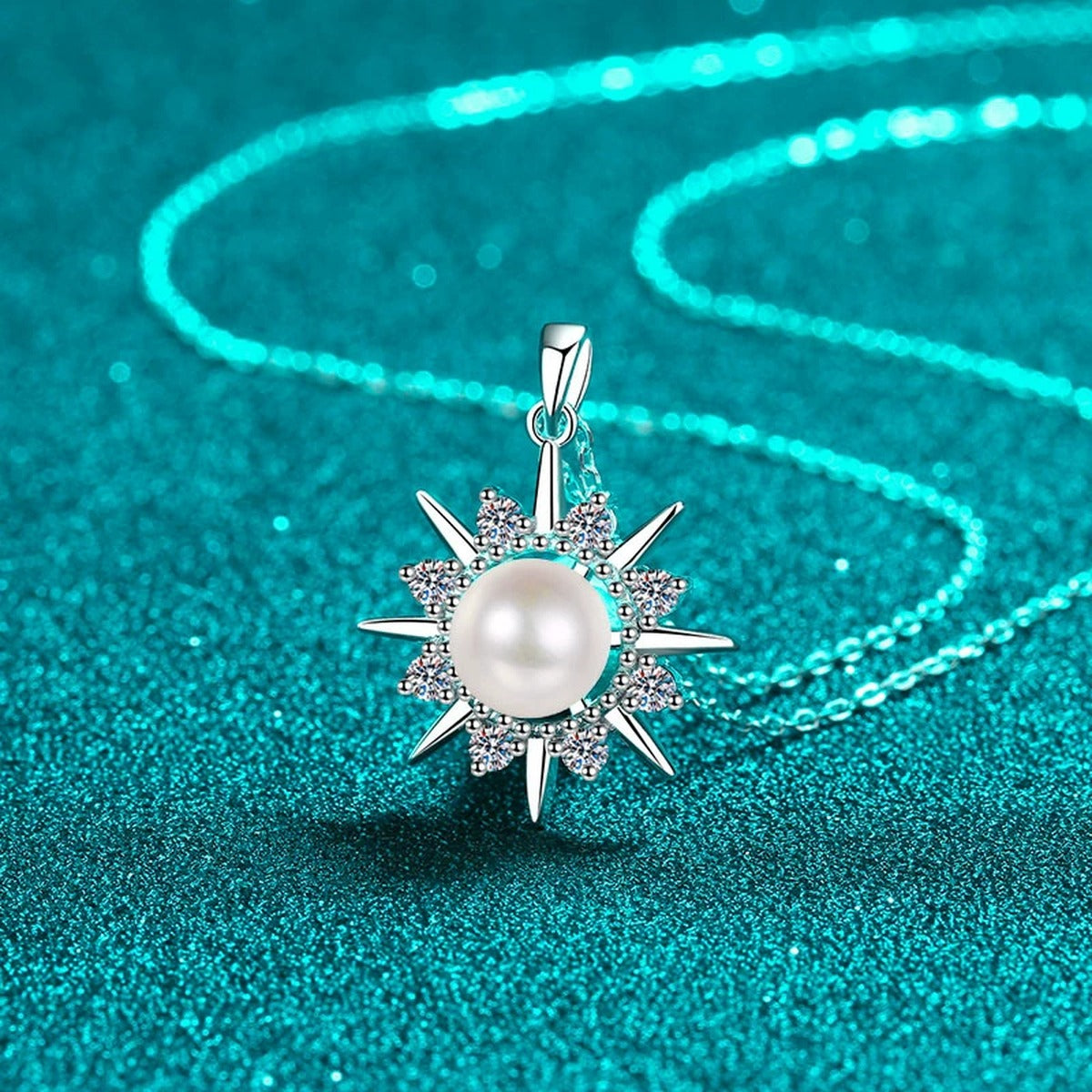 Sunburst Moissanite Pearl Pendant Necklace in Rhodium-Plated S925 sterling silver blue display scene showing chain and stone layout