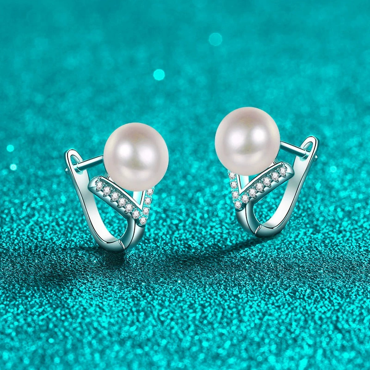 Pearl and Moissanite Huggie Hoop Earrings in Rhodium-Plated S925 sterling silver product scene view showing angled setting detail