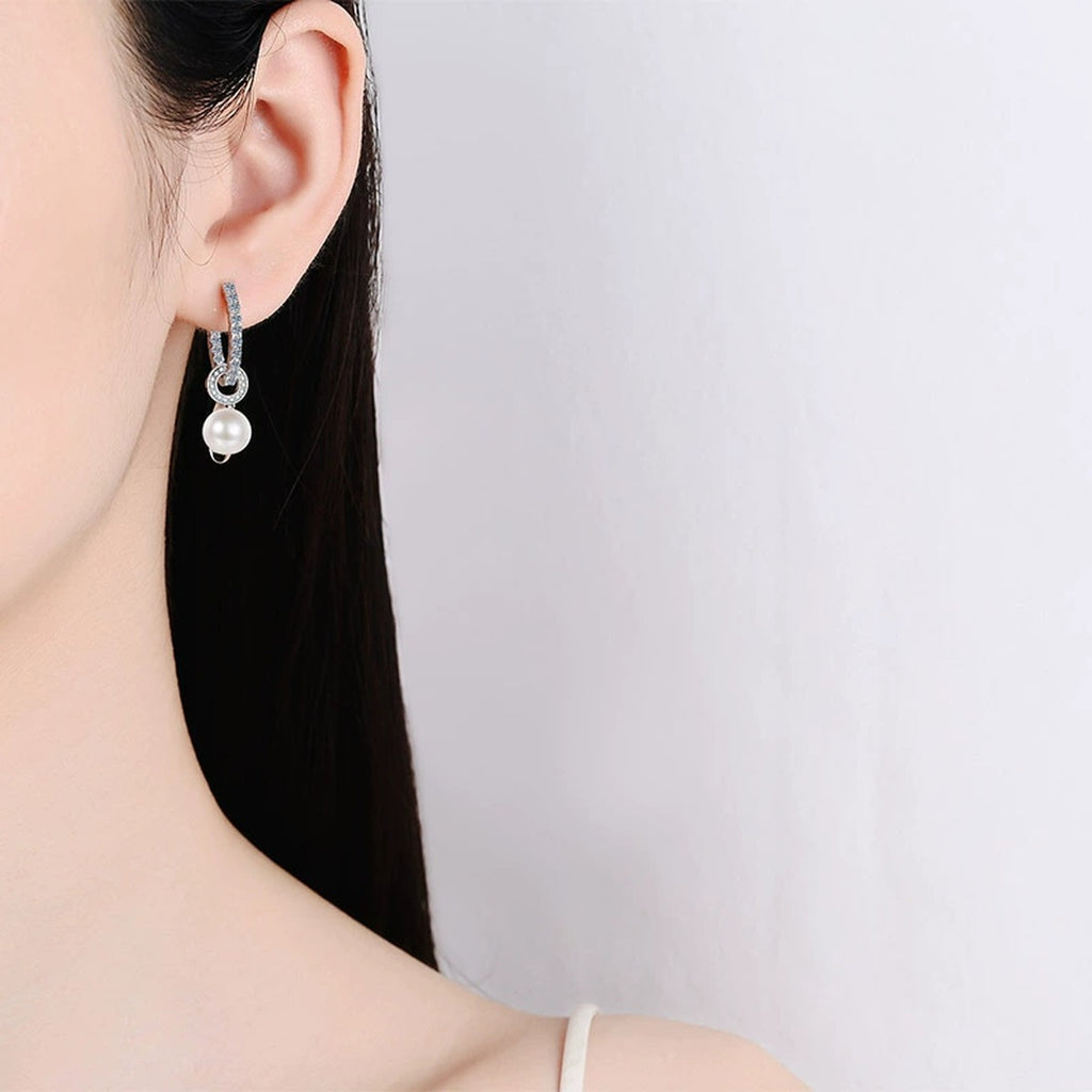 Pearl and Moissanite Hoop Drop Earrings in Rhodium-Plated S925 sterling silver worn on ear by model showing scale, placement, and hoop drop earrings styling