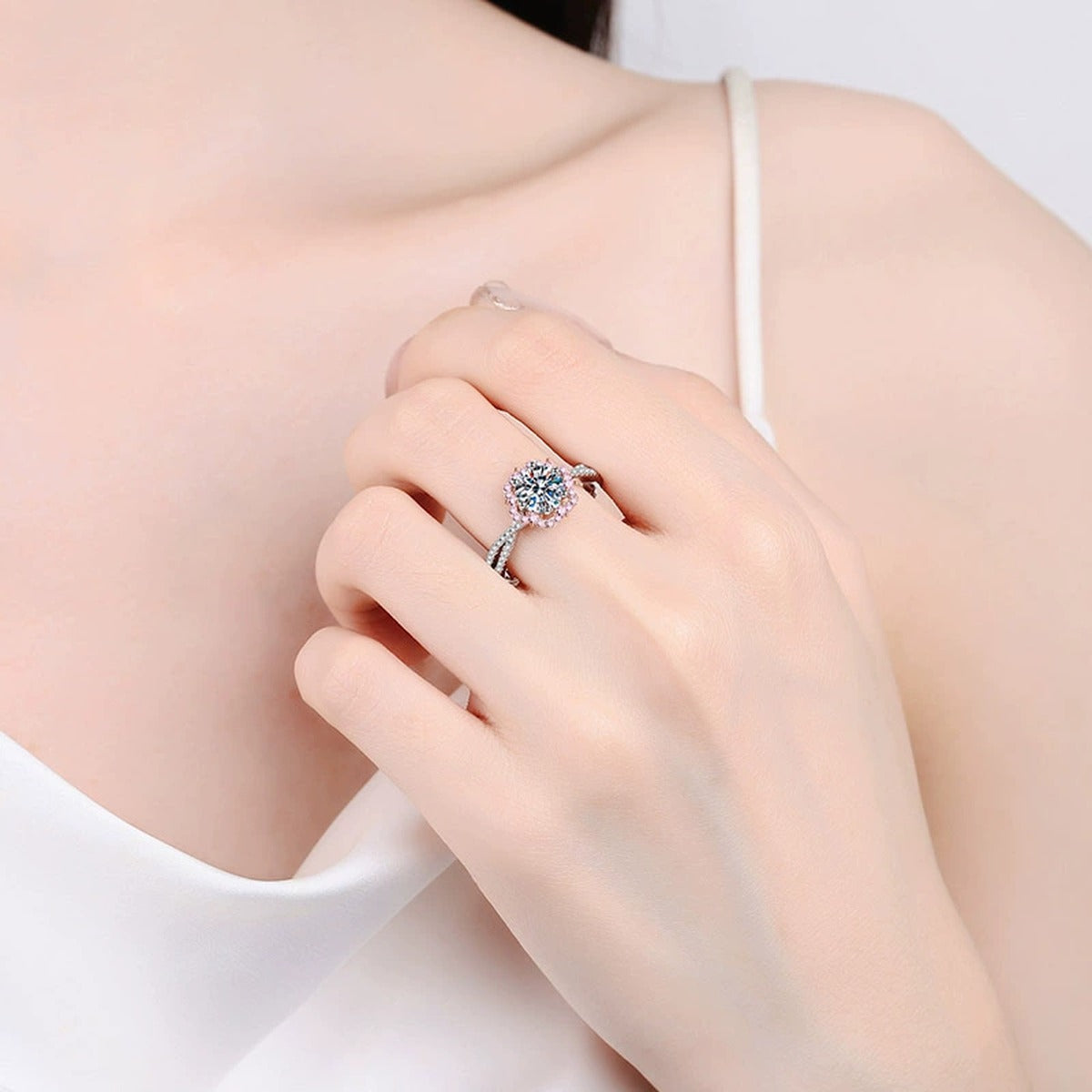 Round Moissanite Ring with Pink CZ worn on hand to show scale, band width, and ring profile