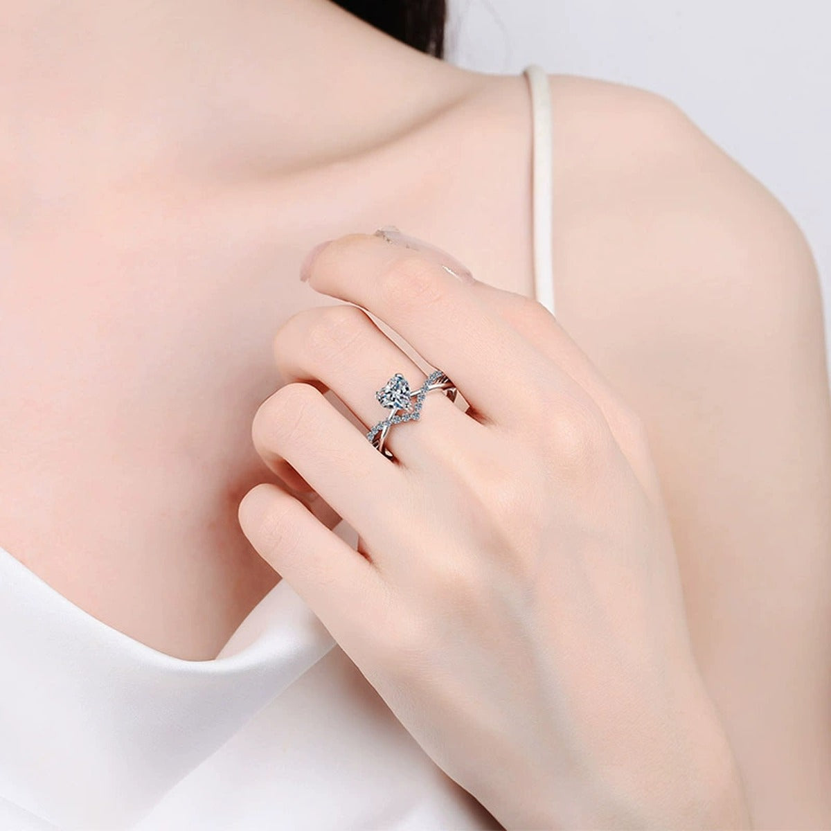 Heart Cut Moissanite Ring with CZ worn on hand to show scale, band width, and ring profile