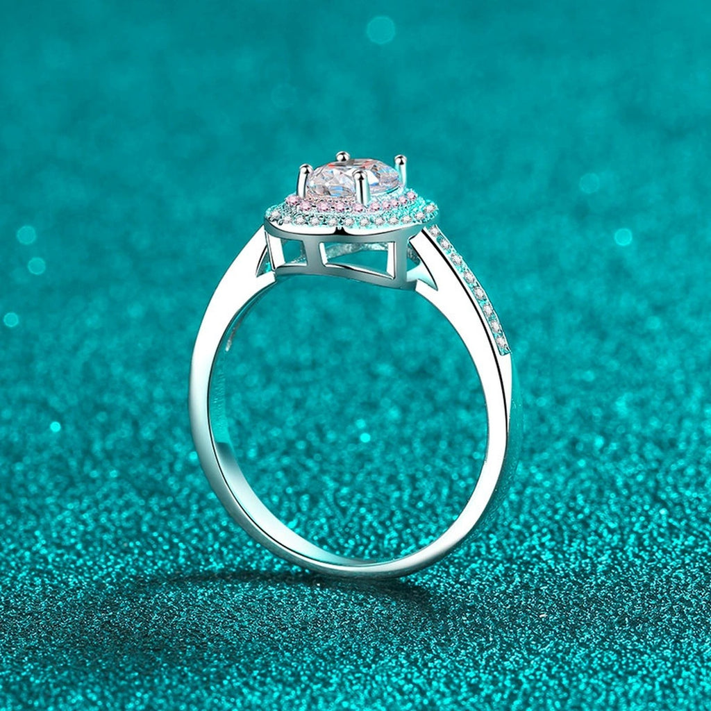 Oval Cut Moissanite Ring with Pink CZ in Rhodium-Plated S925 Sterling Silver blue display product photo showing the moissanite setting, stone cut, and band profile
