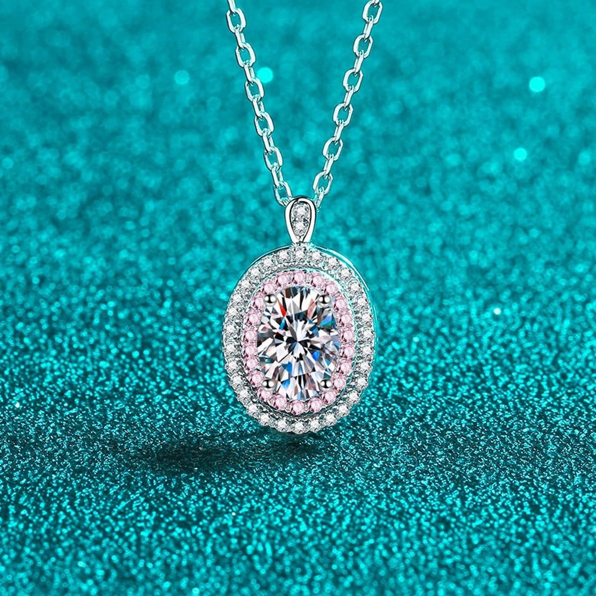 Pink CZ Oval Moissanite Halo Pendant Necklace in Rhodium-Plated S925 sterling silver blue display scene showing chain and stone layout