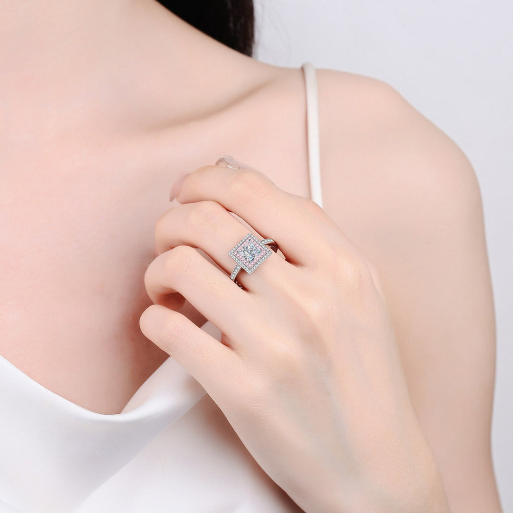 Princess Cut Moissanite Ring with Pink CZ worn on hand to show scale, band width, and ring profile