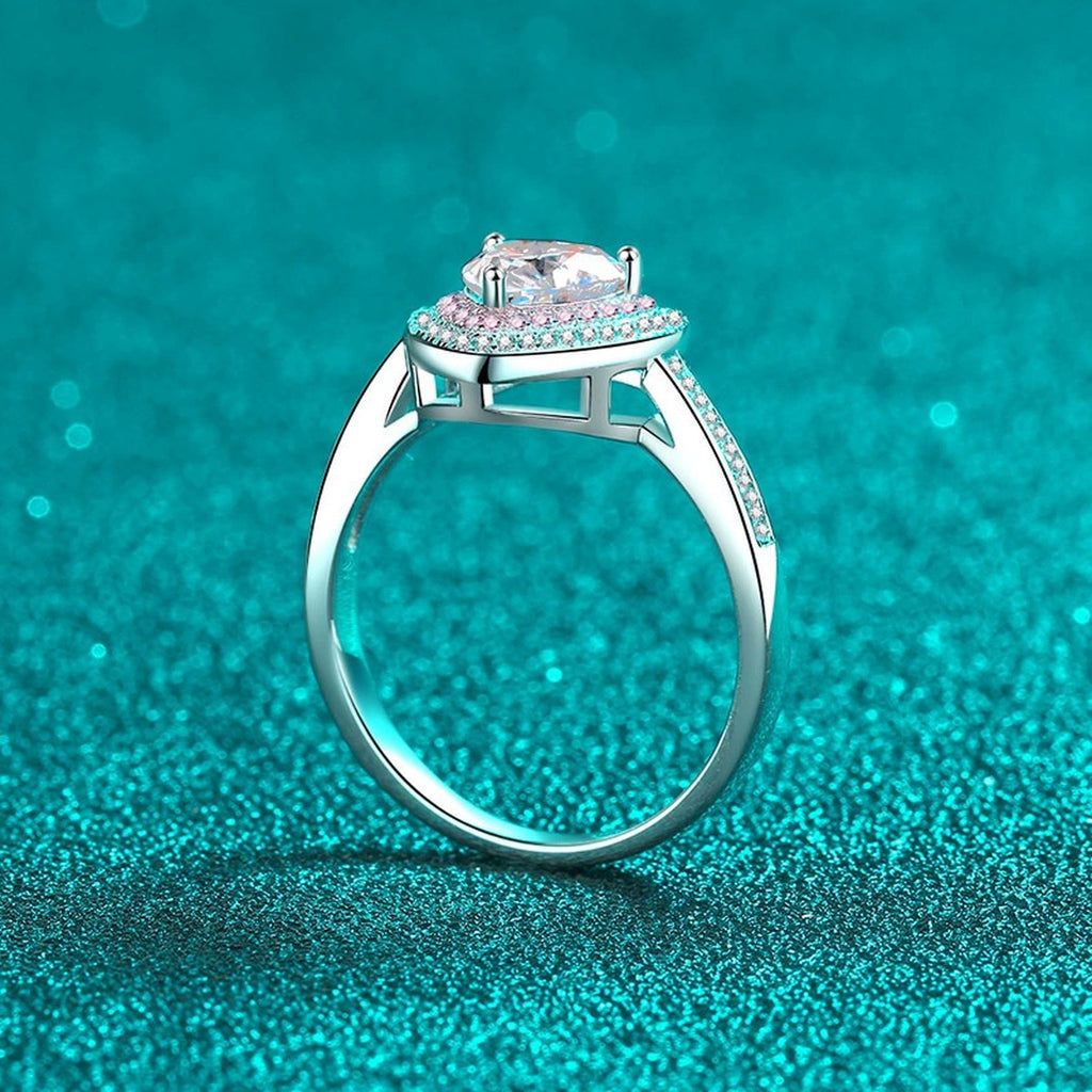 Heart Cut Moissanite Ring with Pink CZ in Rhodium-Plated S925 Sterling Silver blue display product photo showing the moissanite setting, stone cut, and band profile