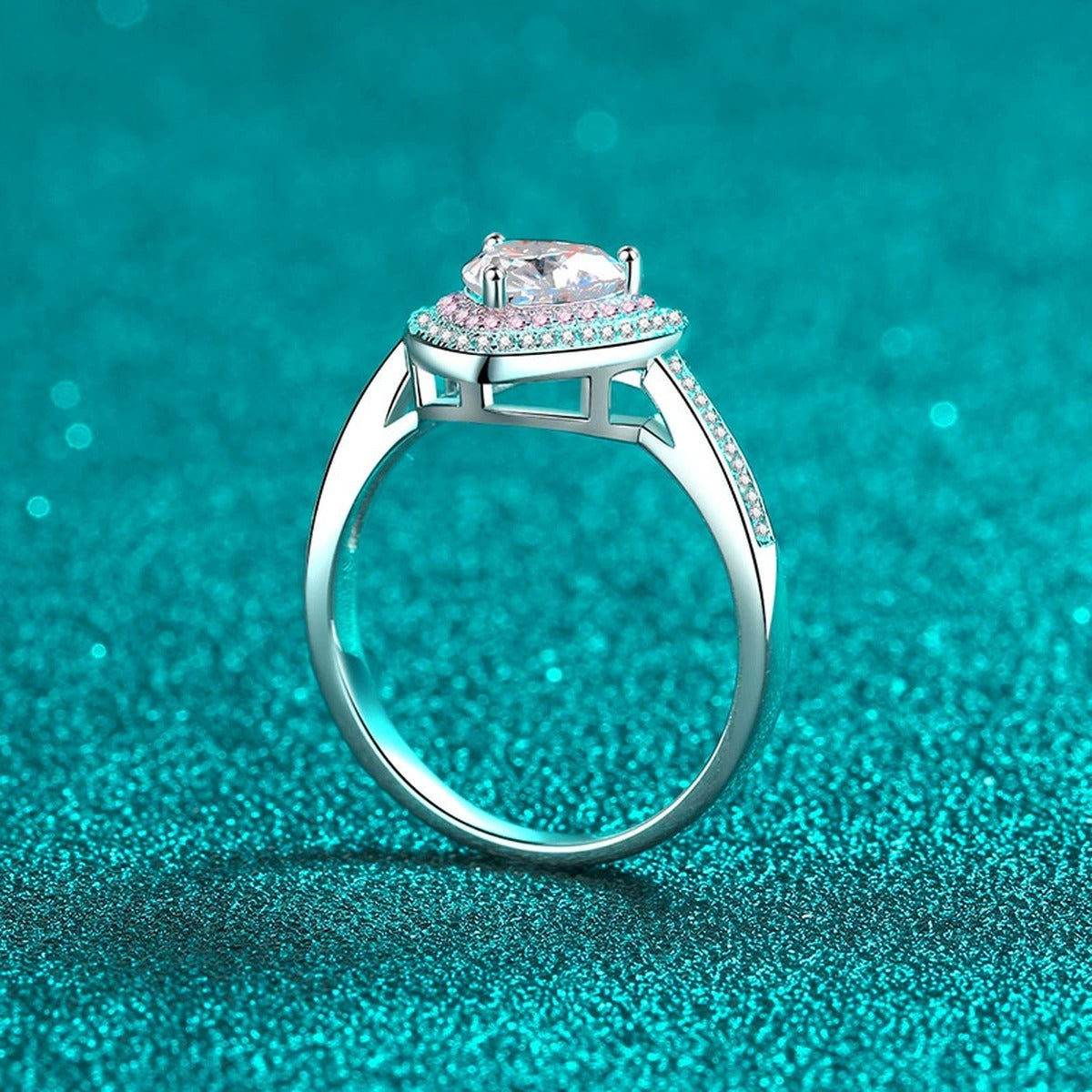 Heart Cut Moissanite Ring with Pink CZ in Rhodium-Plated S925 Sterling Silver blue display product photo showing the moissanite setting, stone cut, and band profile