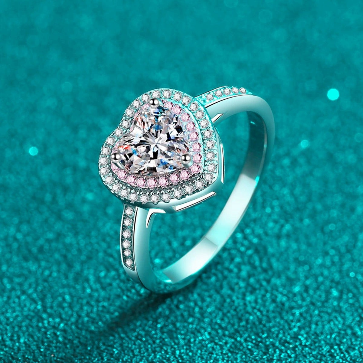 Heart Cut Moissanite Ring with Pink CZ in Rhodium-Plated S925 Sterling Silver blue display product photo showing the moissanite setting, stone cut, and band profile