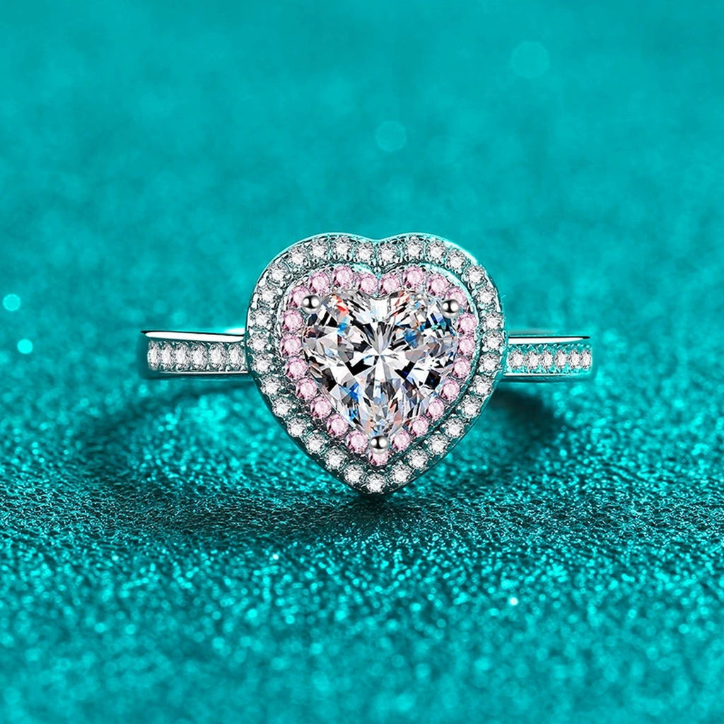 Heart Cut Moissanite Ring with Pink CZ in Rhodium-Plated S925 Sterling Silver blue display product photo showing the moissanite setting, stone cut, and band profile