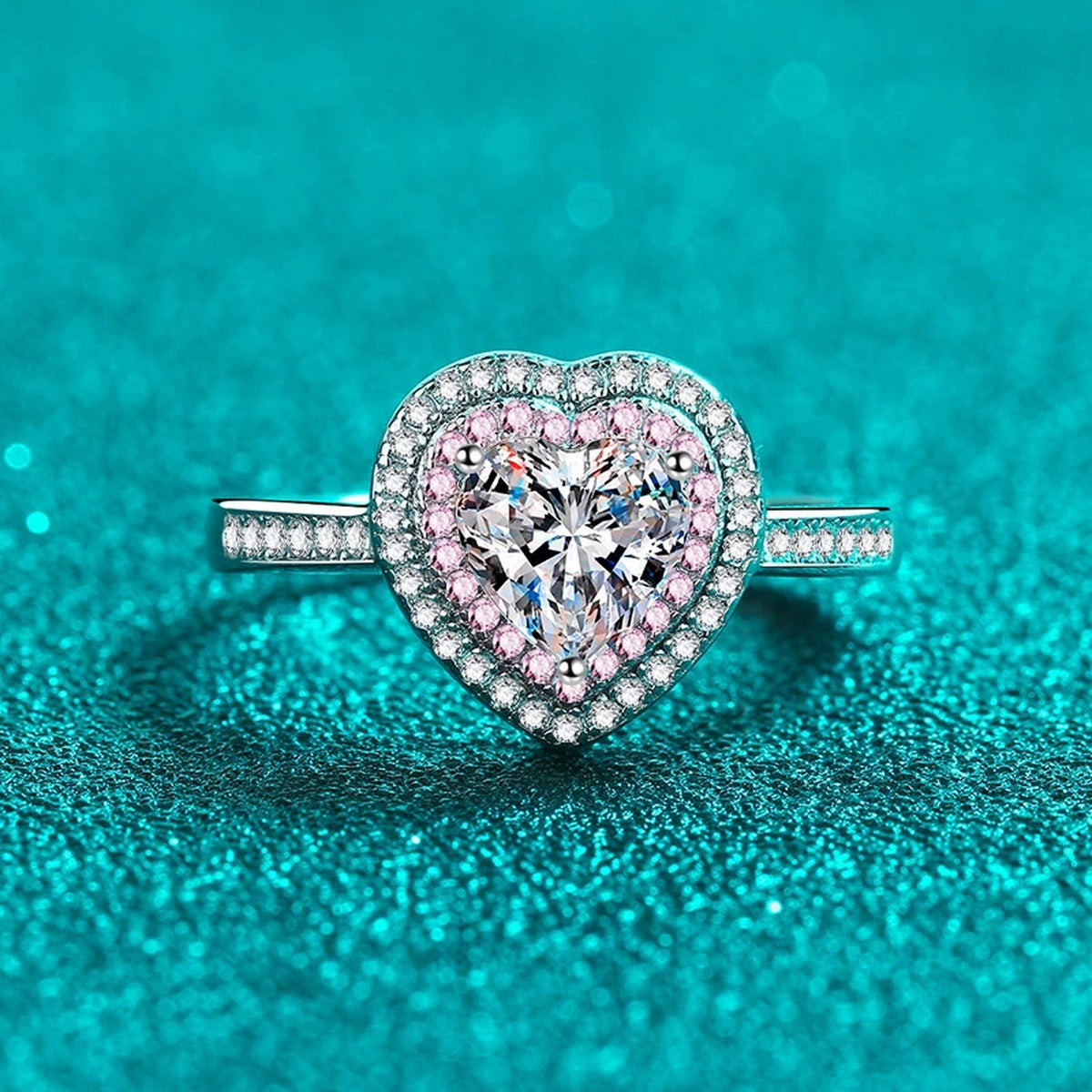 Heart Cut Moissanite Ring with Pink CZ in Rhodium-Plated S925 Sterling Silver blue display product photo showing the moissanite setting, stone cut, and band profile