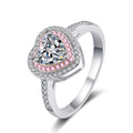 Heart Cut Moissanite Ring with Pink CZ in Rhodium-Plated S925 Sterling Silver clean white background product photo showing the ring silhouette and moissanite setting