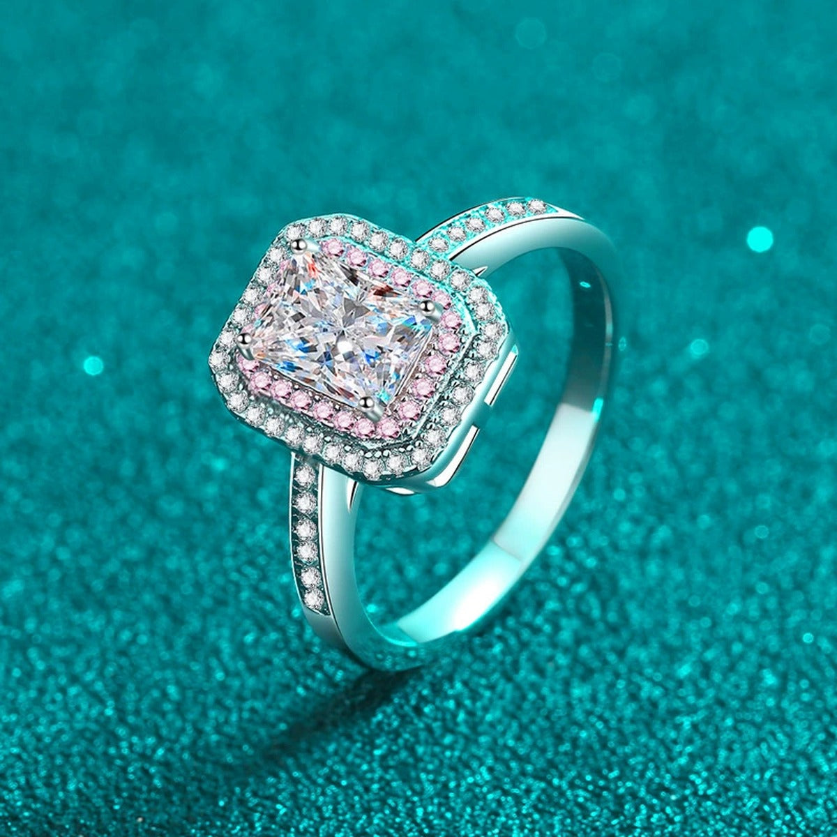 Emerald and Radiant Cut Moissanite Ring with Pink CZ in Rhodium-Plated S925 Sterling Silver blue display product photo showing the moissanite setting, stone cut, and band profile