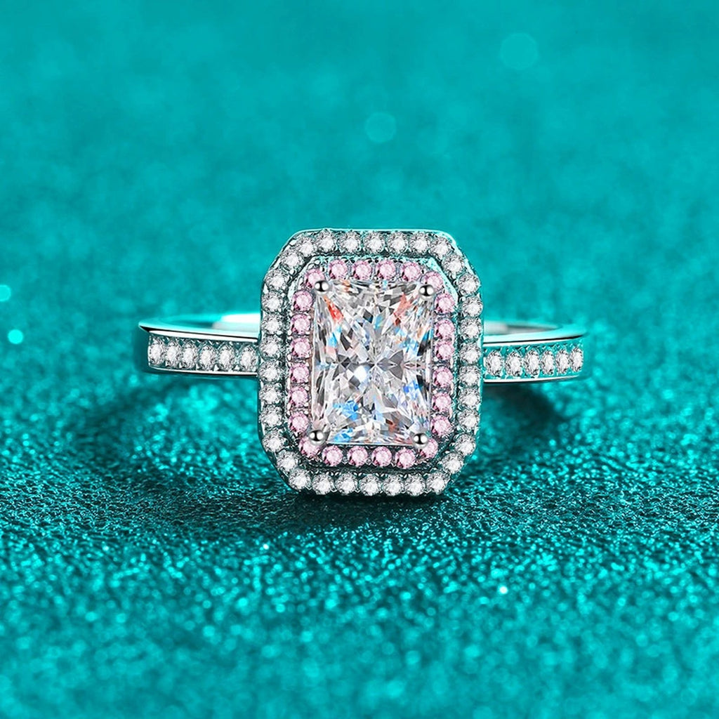 Emerald and Radiant Cut Moissanite Ring with Pink CZ in Rhodium-Plated S925 Sterling Silver blue display product photo showing the moissanite setting, stone cut, and band profile