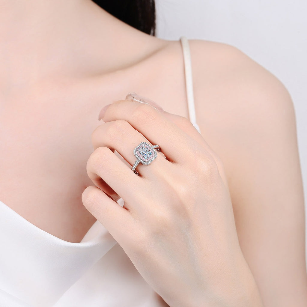 Emerald and Radiant Cut Moissanite Ring with Pink CZ in Rhodium-Plated S925 Sterling Silver worn on hand, showing scale, finger coverage, and rhodium-plated finish