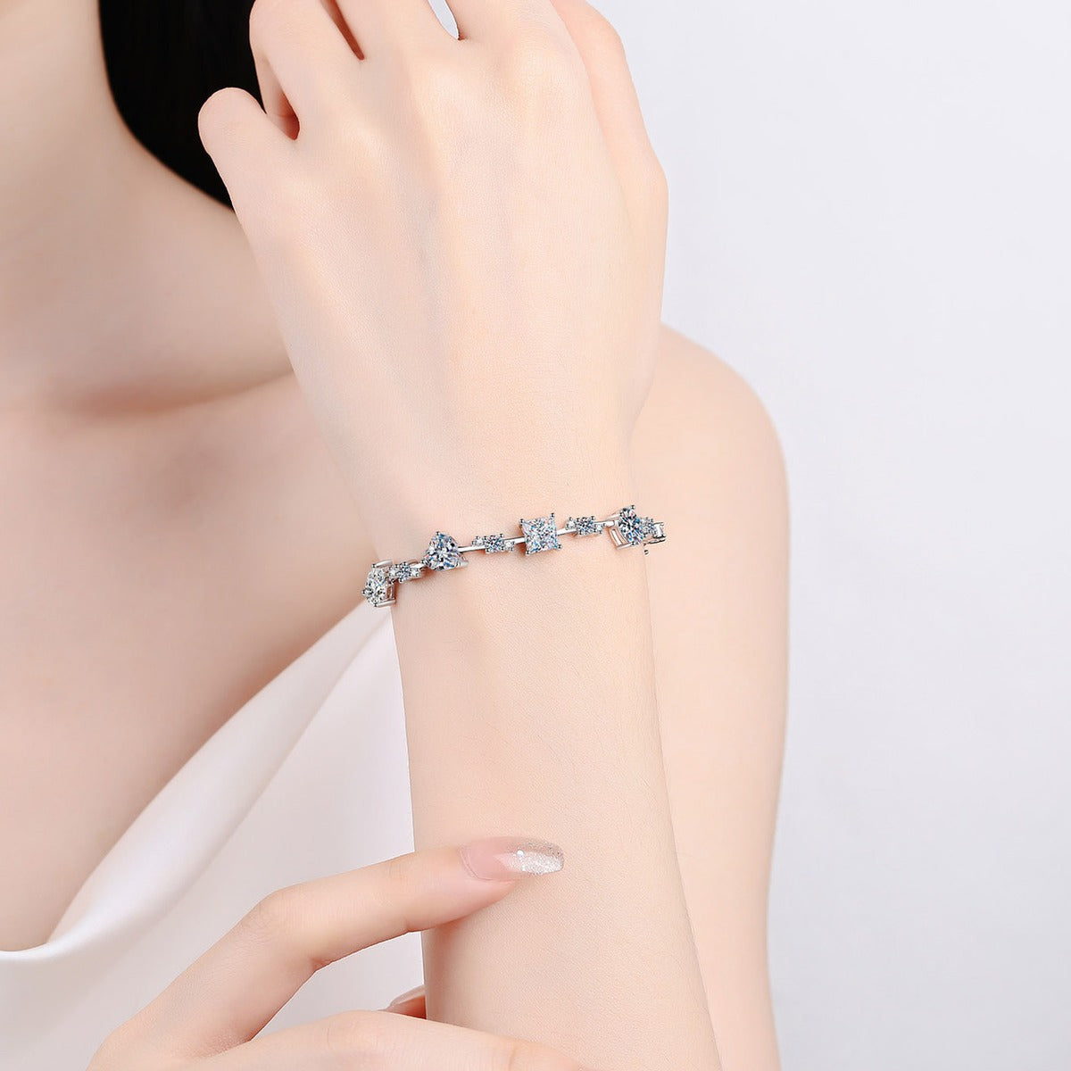 Mixed Cut Moissanite Tennis Bracelet in Rhodium-Plated S925 sterling silver worn on wrist model view showing scale and adjustable fit