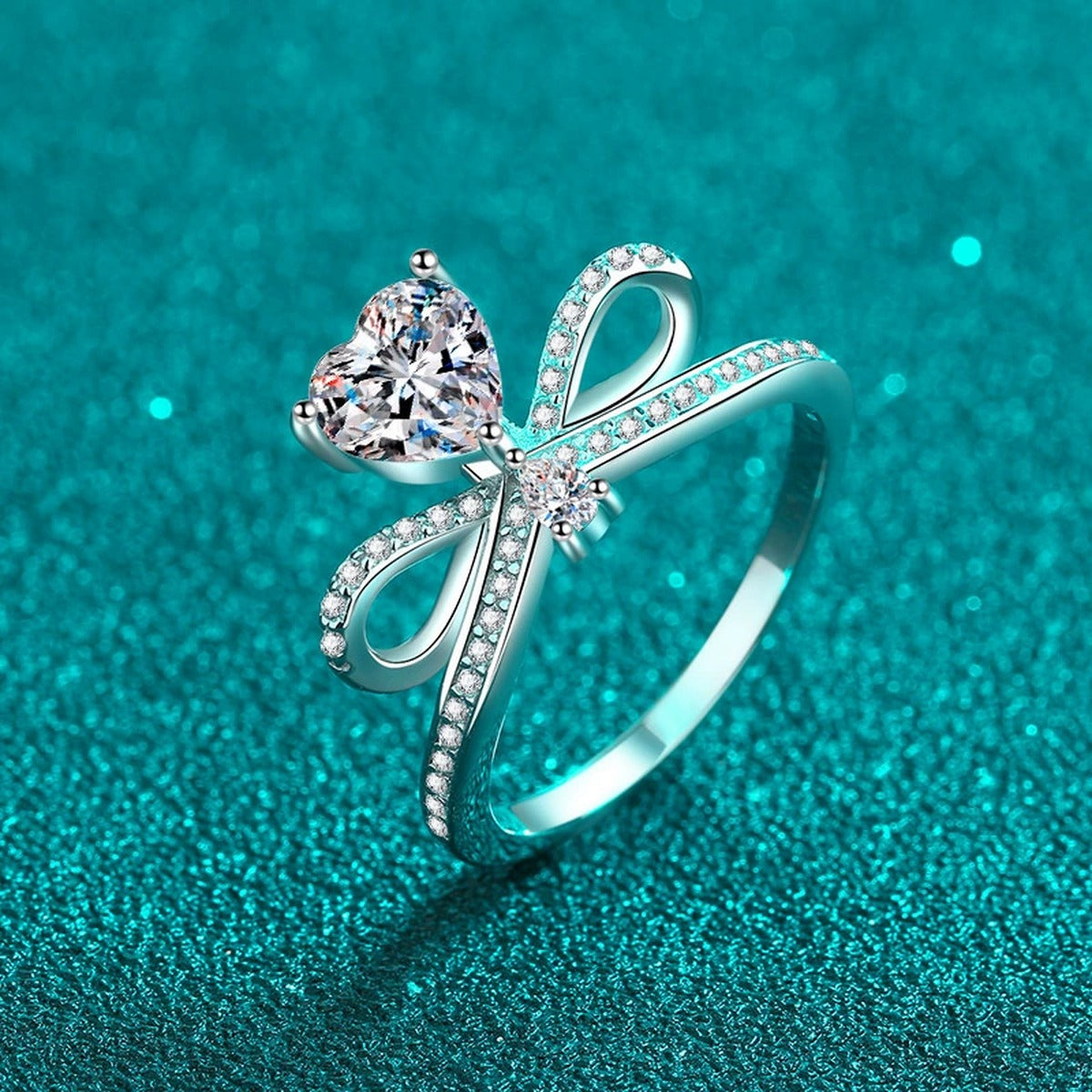 Heart Cut Moissanite Side Stone Engagement Ring with CZ in Rhodium-Plated S925 Sterling Silver blue display product photo showing the moissanite setting, stone cut, and band profile