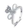 Heart Cut Moissanite Side Stone Engagement Ring with CZ in Rhodium-Plated S925 Sterling Silver clean white background product photo showing the ring silhouette and moissanite setting