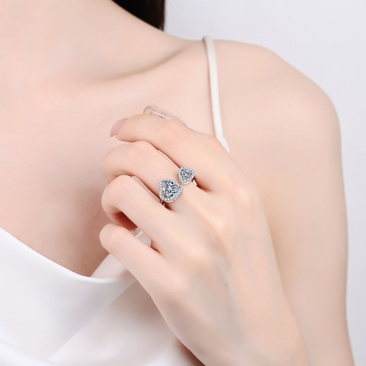 Double Heart Moissanite Adjustable Ring worn on hand to show scale, band width, and ring profile