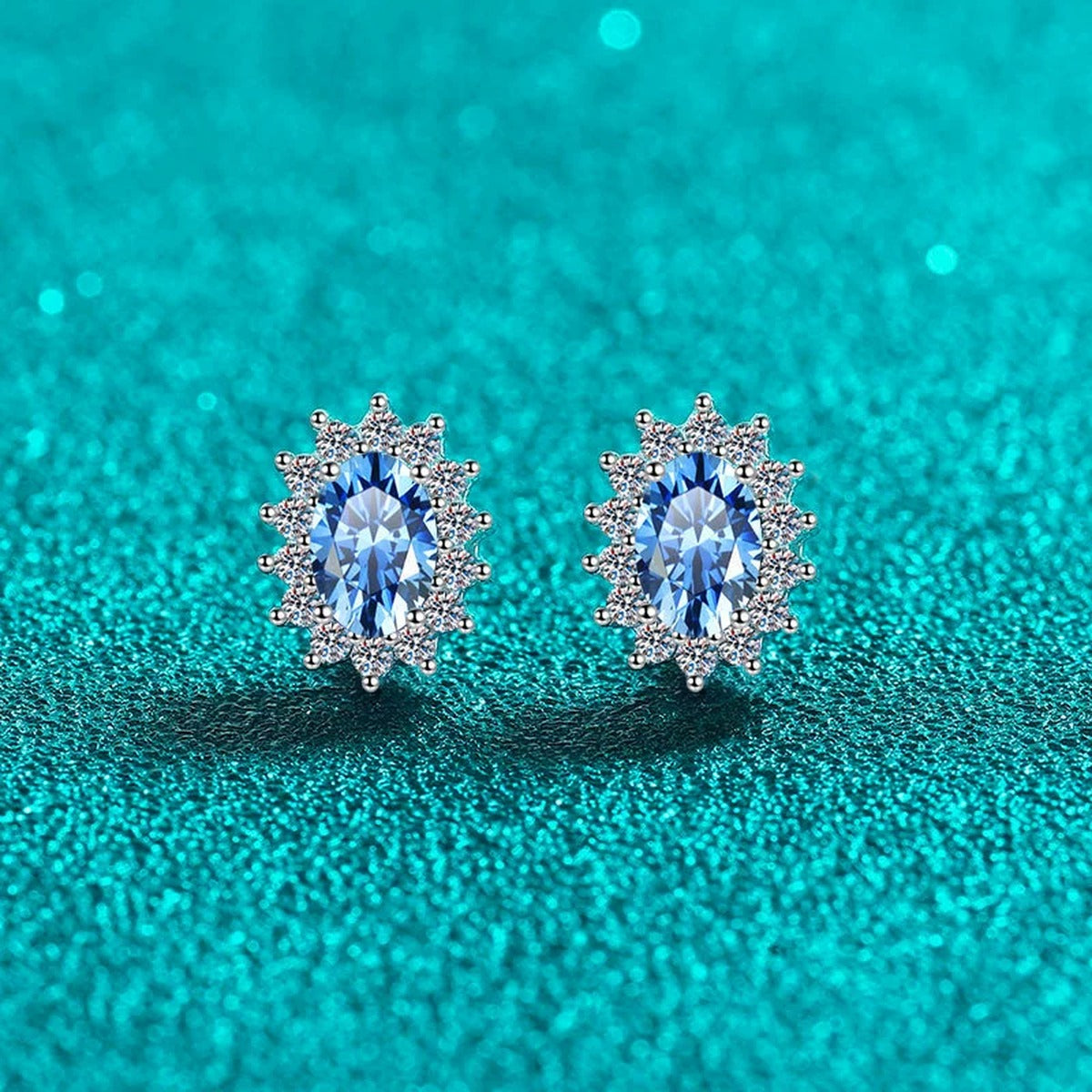 Blue Oval Moissanite Halo Stud Earrings with CZ in Rhodium-Plated S925 sterling silver product scene view showing side profile