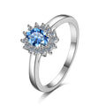 Blue Oval Moissanite Ring with CZ in Rhodium-Plated S925 Sterling Silver clean white background product photo showing the ring silhouette and moissanite setting