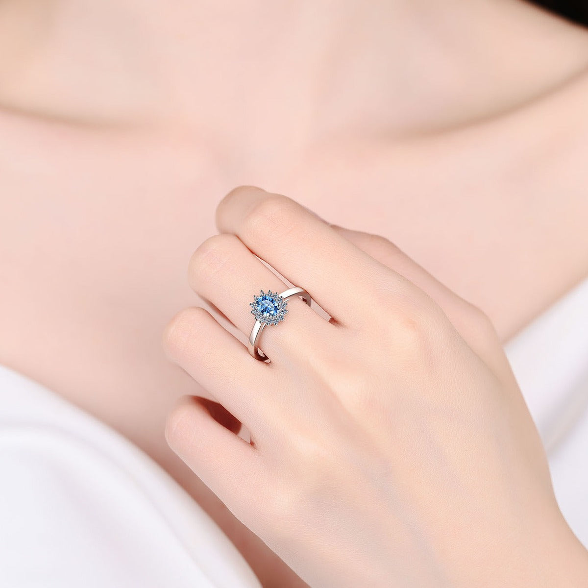 Blue Oval Moissanite Ring with CZ in Rhodium-Plated S925 Sterling Silver worn on hand, showing scale, finger coverage, and rhodium-plated finish