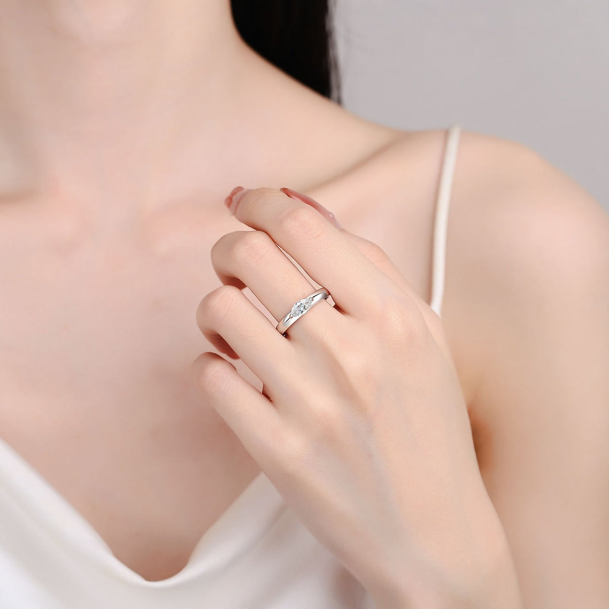 Marquise Cut Moissanite Ring worn on hand to show scale, band width, and ring profile